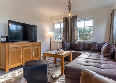 Wohnzimmer in der Ferienwohnung R1 Haubarg & Remise St. Peter-Ording